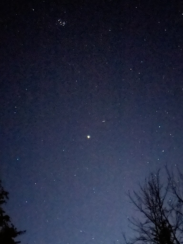 A dark starfilled night with the brightest star at the center